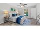 Bedroom features a ceiling fan, a view of the pool, and contemporary decor at 1217 Carmella Ln, Sarasota, FL 34243