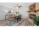 Dining room with fireplace, modern table set, and a ceiling fan at 1217 Carmella Ln, Sarasota, FL 34243