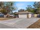 Inviting single-story home with a spacious driveway and stone accents at 1217 Carmella Ln, Sarasota, FL 34243