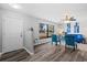 Bright living room featuring updated flooring, a large window, and modern furniture at 1217 Carmella Ln, Sarasota, FL 34243