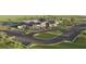 Aerial view of community clubhouse, parking and surrounding green spaces at 1219 Kazaz Ct, Zephyrhills, FL 33540