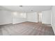 Large loft area with neutral carpeting and bright white walls at 1219 Kazaz Ct, Zephyrhills, FL 33540