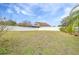 Backyard with a large grassy area and fence at 12705 Bramfield Dr, Riverview, FL 33579