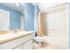 Full bathroom with shower/tub combo and light blue walls at 12705 Bramfield Dr, Riverview, FL 33579