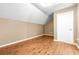 Upstairs bedroom with wood floors and neutral walls at 12705 Bramfield Dr, Riverview, FL 33579