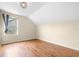 Upstairs bedroom with wood floors and window with curtains at 12705 Bramfield Dr, Riverview, FL 33579