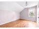 Bright bedroom with wood floors, window, and neutral walls at 12705 Bramfield Dr, Riverview, FL 33579