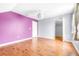 Bedroom with wood floors and purple and grey walls at 12705 Bramfield Dr, Riverview, FL 33579