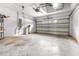 Spacious garage with concrete floor and storage shelving at 12705 Bramfield Dr, Riverview, FL 33579