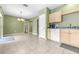 Bright kitchen with light wood cabinets and tile floor at 12705 Bramfield Dr, Riverview, FL 33579