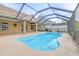 Spacious freeform pool with screened enclosure and patio at 12705 Bramfield Dr, Riverview, FL 33579