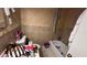 Bathroom shows a toilet and tub with personal items scattered throughout the space at 13634 Twig Ter, Largo, FL 33774