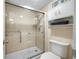 Bathroom with shower stall, toilet and linen storage at 14130 Rosemary Ln # 3204, Largo, FL 33774