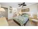 Spacious bedroom with a queen bed and ensuite bathroom access at 14130 Rosemary Ln # 3204, Largo, FL 33774