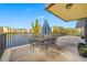 Private patio overlooking a lake with table and chairs at 14130 Rosemary Ln # 3204, Largo, FL 33774