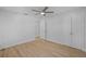 Spacious bedroom with ceiling fan, light flooring, and double door closet at 1418 Barry St, Clearwater, FL 33756