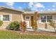 House entrance with white door, landscaping, and a walkway at 1418 Barry St, Clearwater, FL 33756