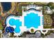 Aerial view of multiple pools in a community setting with connecting water areas, a waterslide, and seating at 14607 Turning Leaf Ct, Tampa, FL 33626