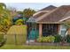 This beautiful backyard features a screened-in patio, lush green lawn, and privacy fence at 14607 Turning Leaf Ct, Tampa, FL 33626