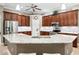 Kitchen featuring island with granite countertop, stainless appliances, and ample cabinet space at 14607 Turning Leaf Ct, Tampa, FL 33626