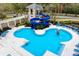 Inviting aerial view of a community pool area with a water slide, various pool sections, and lounge seating at 14607 Turning Leaf Ct, Tampa, FL 33626