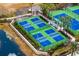 Aerial view of blue and green tennis courts at 14607 Turning Leaf Ct, Tampa, FL 33626