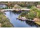 A scenic view of a community entrance sign surrounded by a pond and lush greenery at 14607 Turning Leaf Ct, Tampa, FL 33626