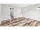 Bright, empty bedroom with wood-look flooring and neutral paint at 15422 Wine Dr, Weeki Wachee, FL 34614