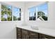 Bright bathroom with quartz countertop and large windows at 156 29Th N Ave, St Petersburg, FL 33704