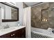 Bathroom with soaking tub, tiled shower, and vanity with marble top at 156 29Th N Ave, St Petersburg, FL 33704