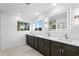 Elegant bathroom with double vanity, quartz countertop, and LED mirror at 156 29Th N Ave, St Petersburg, FL 33704