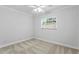 Well-lit bedroom with carpet, ceiling fan, and window with blinds at 156 29Th N Ave, St Petersburg, FL 33704