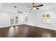 Bright bedroom with hardwood floors, ceiling fans, and access to a patio at 156 29Th N Ave, St Petersburg, FL 33704