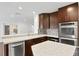 Modern kitchen with stainless steel appliances and granite countertops at 156 29Th N Ave, St Petersburg, FL 33704