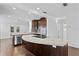 Modern kitchen with dark wood cabinets and a large island at 156 29Th N Ave, St Petersburg, FL 33704