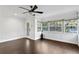 Living room with hardwood floors, ceiling fan and backyard access at 156 29Th N Ave, St Petersburg, FL 33704