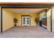 Covered patio with French doors and heart rug at 156 29Th N Ave, St Petersburg, FL 33704