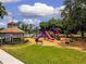 Fun playground area with slides and play structures next to a charming gazebo at 16908 Equestrian Trl, Odessa, FL 33556