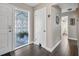 Inviting foyer with decorative glass, tile flooring, and access to other parts of the house at 1745 Emerald Dr, Clearwater, FL 33756