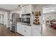 This kitchen showcases stainless steel appliances, bright white cabinets, and light countertops in an open space at 1745 Emerald Dr, Clearwater, FL 33756