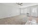 A living room with a view of the front door and tile flooring in the dining area at 1901 Andover Way # 32, Sun City Center, FL 33573