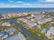 Stunning aerial view of waterfront townhomes with boat docks and ocean access in a beautiful community at 192 Haven Beach Dr, Indian Rocks Beach, FL 33785