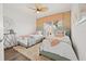 Charming bedroom with two twin beds, warm accents, and bright windows, perfect for children or guests at 192 Haven Beach Dr, Indian Rocks Beach, FL 33785