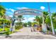 Indian Rocks Beach neighborhood entrance with palm trees and blue skies at 192 Haven Beach Dr, Indian Rocks Beach, FL 33785