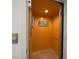 Interior view of elevator with tile flooring, wood interior, and 'Life is Good at the Beach' sign at 192 Haven Beach Dr, Indian Rocks Beach, FL 33785