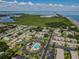 Aerial view of the apartment community, showcasing the mature trees and landscaping at 205 S Mcmullen Booth Rd # 202, Clearwater, FL 33759