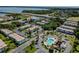 An aerial view of the apartments featuring a swimming pool, lush greenery, and convenient parking at 205 S Mcmullen Booth Rd # 202, Clearwater, FL 33759