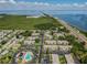 Aerial view of the apartments near the water, showing the convenient location and community pool at 205 S Mcmullen Booth Rd # 202, Clearwater, FL 33759