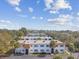 Aerial view of apartments exhibiting landscaping and attractive two-story buildings at 205 S Mcmullen Booth Rd # 202, Clearwater, FL 33759