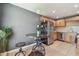 View of the kitchen, with stainless steel refrigerator and nearby dining area at 205 S Mcmullen Booth Rd # 202, Clearwater, FL 33759